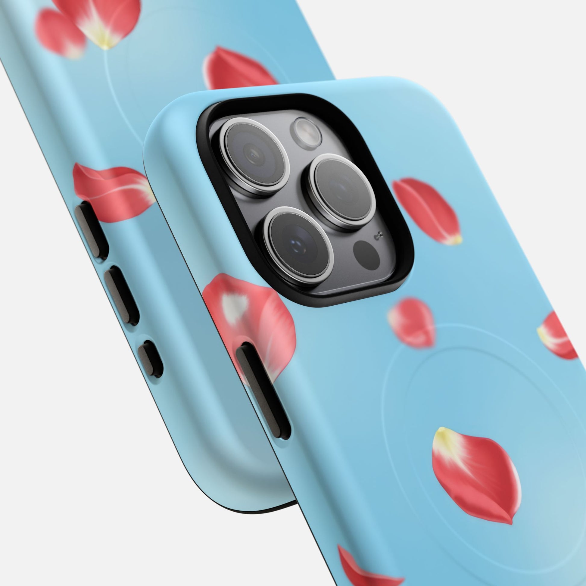 Light blue phone case with floating red rose petals design, fits iPhone Pro camera