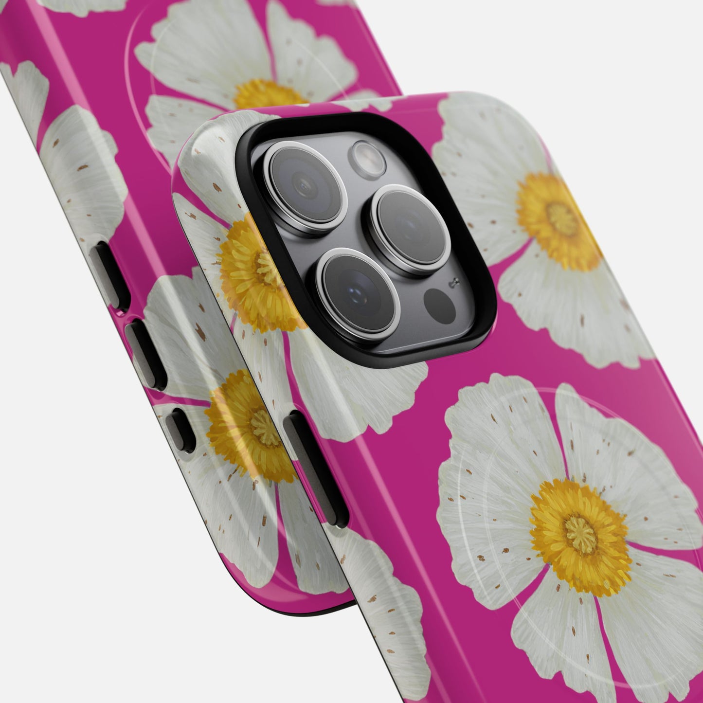 Pink phone case with white daisy flowers and yellow centers, designed for iPhone camera cutout