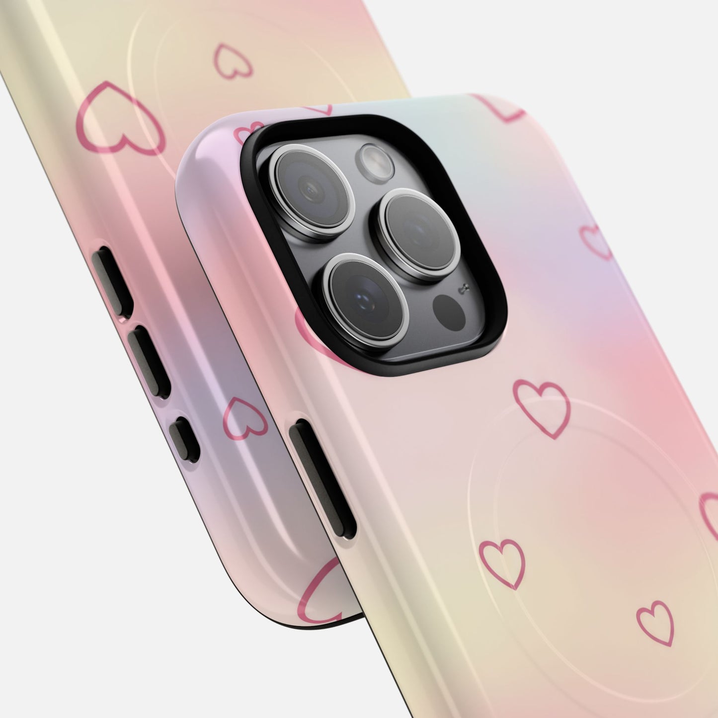 Pastel gradient phone case with pink hearts, designed for iPhone Pro models, featuring precise camera cutout and stylish protection.