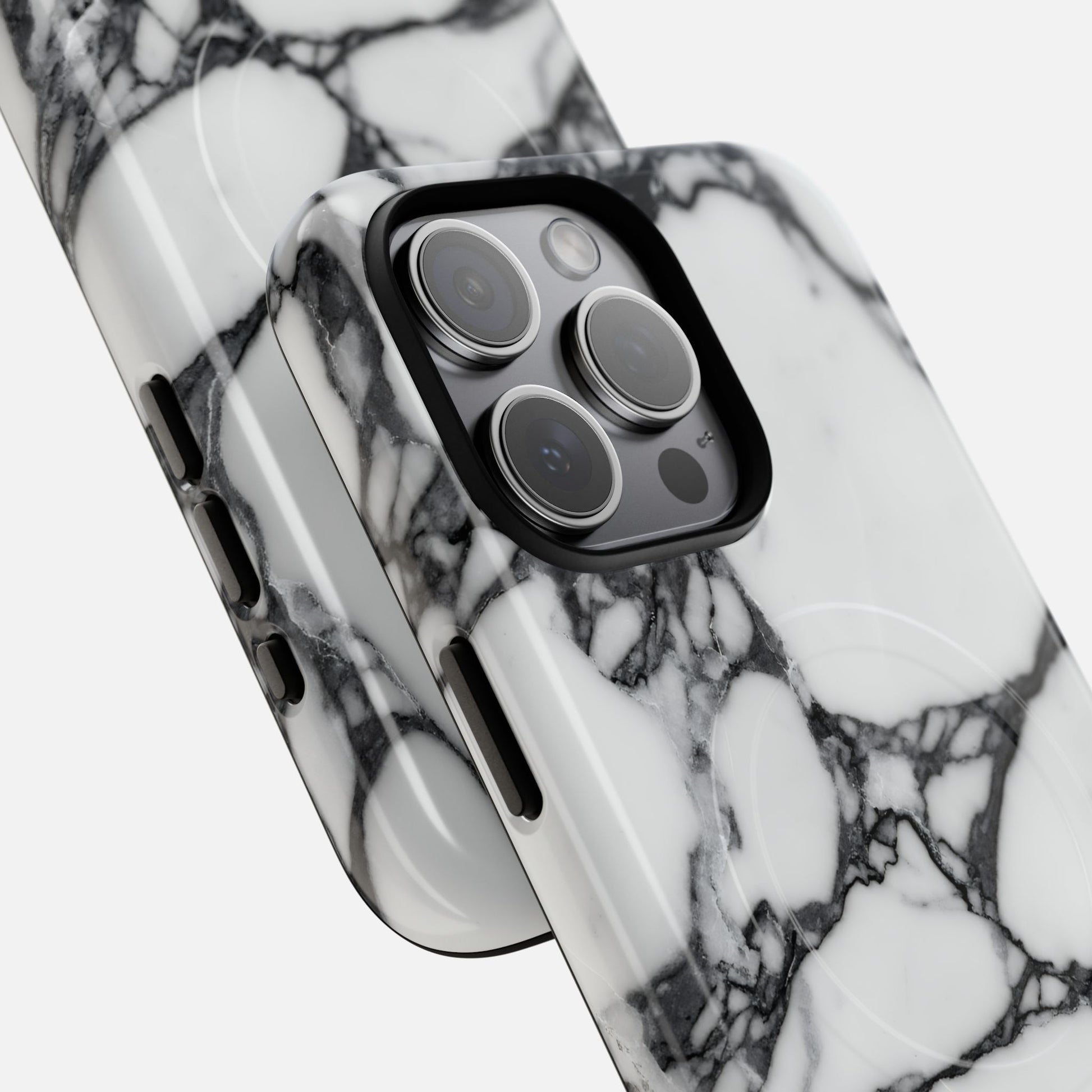 Black and white marble design phone case on modern smartphone, close-up view