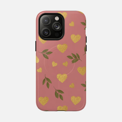 Pink phone case with gold hearts and green leaves, stylish protective cover for iPhone