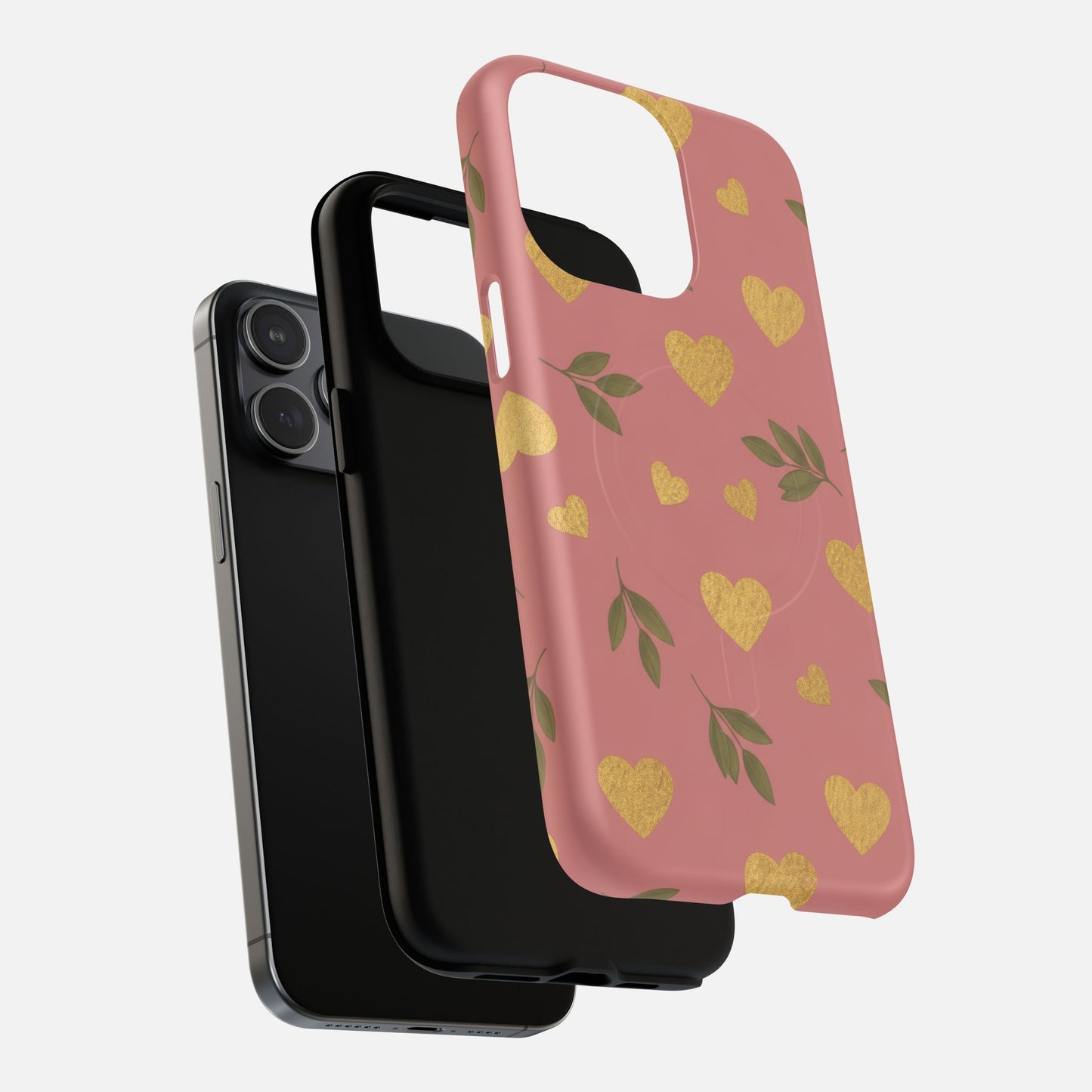 Pink phone case with gold hearts and green leaves, shown with black iPhone and case