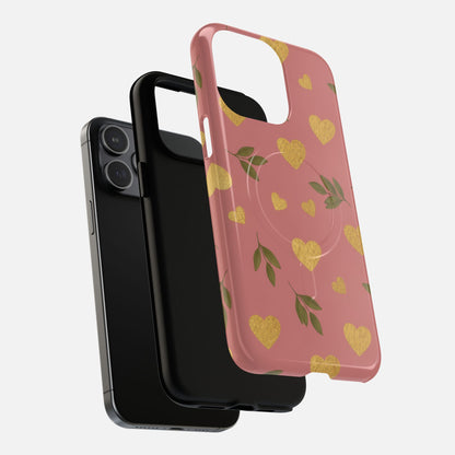 Pink phone case with gold hearts and green leaves, compatible with iPhone models, stylish and protective design.