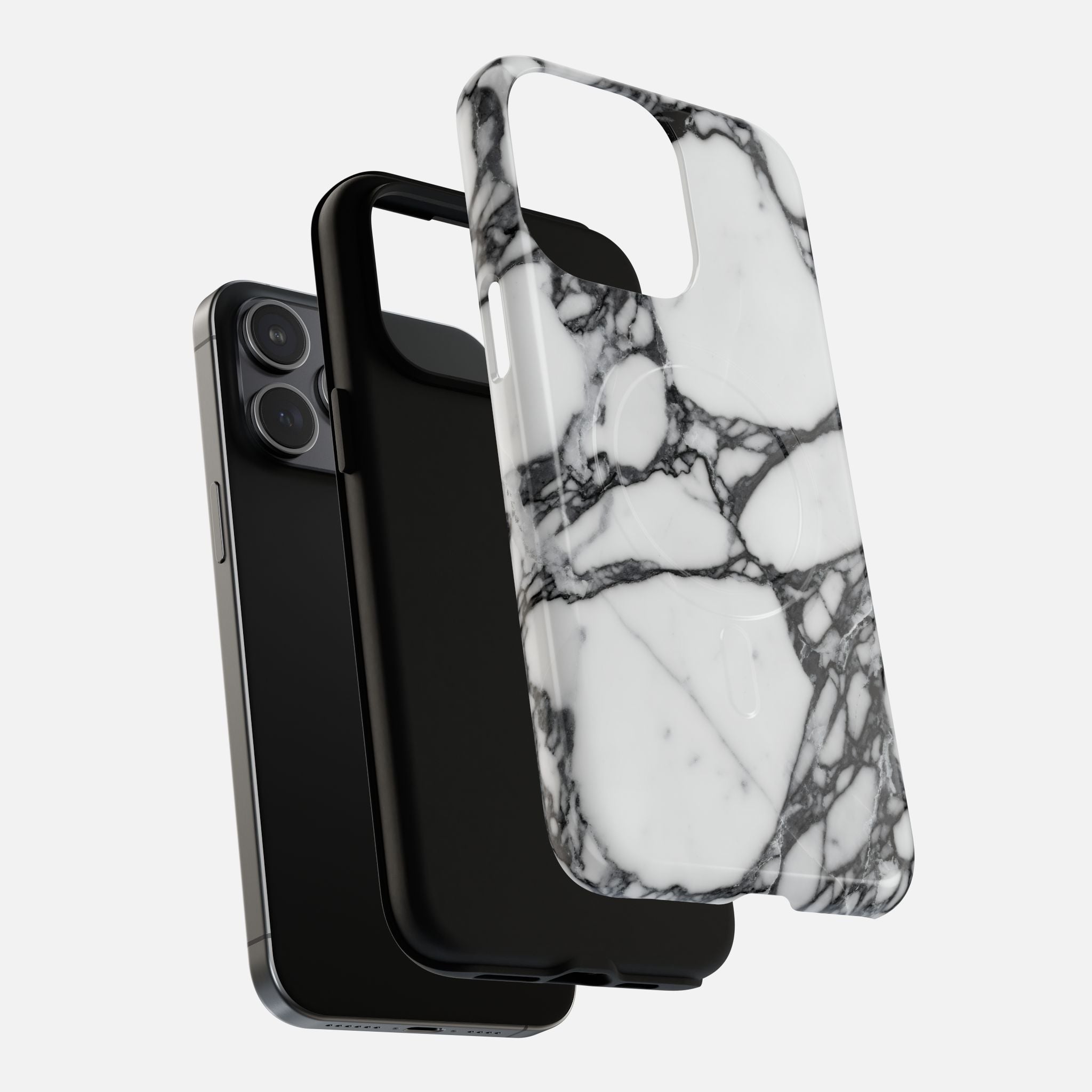 White marble pattern phone case with black veining, shown with black iPhone and case
