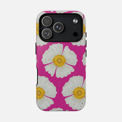Vibrant pink phone case with white daisy flowers and yellow centers, modern floral design for iPhone