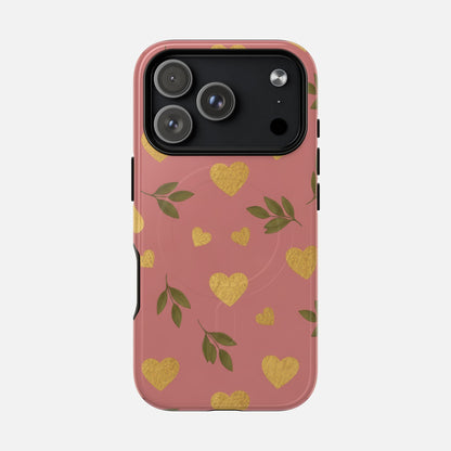 Pink phone case with gold glitter hearts and green leaves, stylish protective cover for iPhone