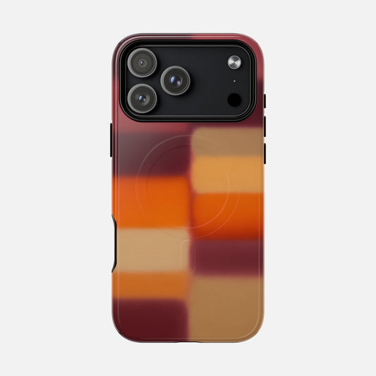 iPhone case with autumn plaid pattern in red, orange, and tan hues, modern design