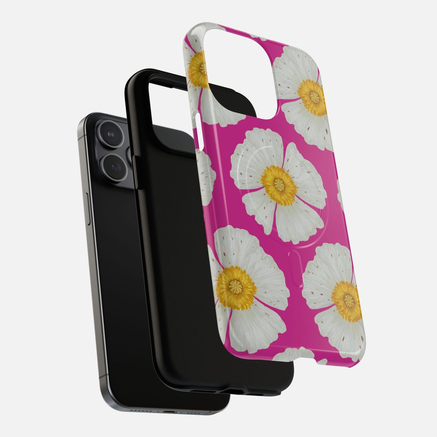Pink floral phone case with white daisies and yellow centers, shown with black iPhone and case